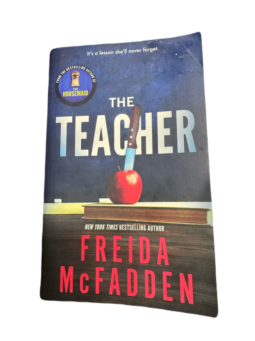 The Teacher by Freida McFadden — Dark Blue Cover with Red Accents